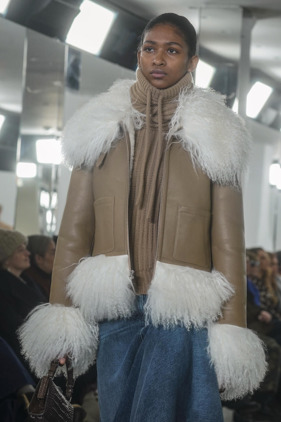 Fashion from Michael Kors fall/winter collection is modeled during Fashion Week, Tuesday, Feb. 13, 2024, in New York. (AP Photo/Bebeto Matthews)