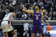 Northwestern guard Boo Buie (0) calls a play in front of Purdue guard Eric Hunter Jr. (2) in the first half of an NCAA college basketball game in West Lafayette, Ind., Sunday, Jan. 23, 2022. Purdue won 80-60. (AP Photo/AJ Mast)