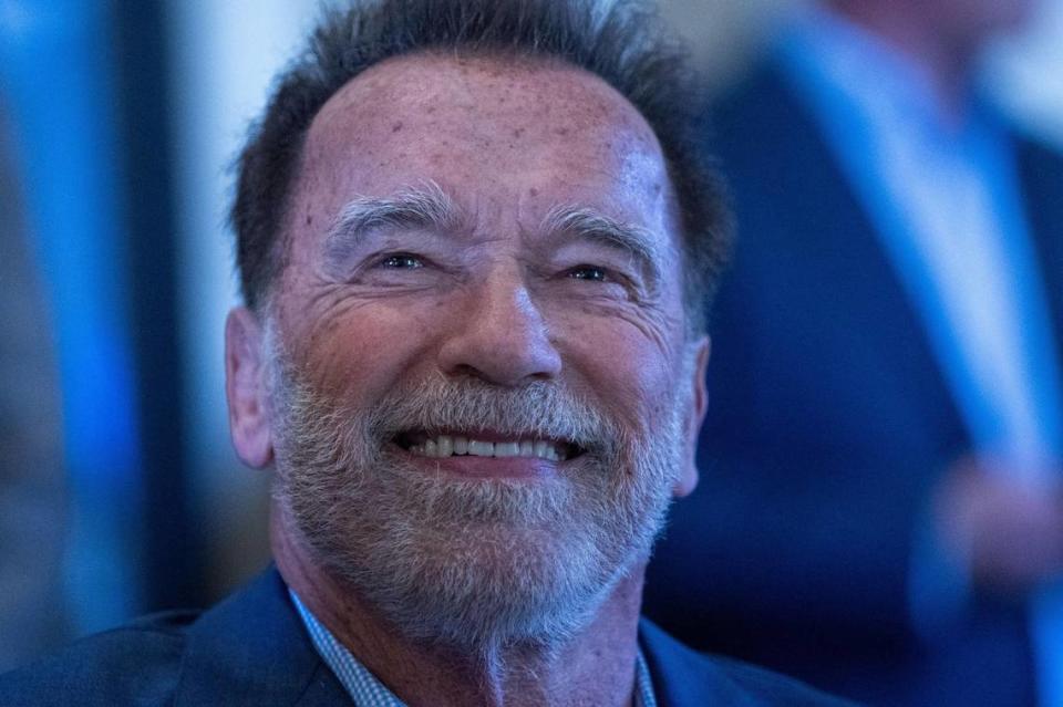 Former Gov. Arnold Schwarzenegger smiles at a Sacramento Press Club luncheon on Friday, the 20th anniversary of his inauguration.