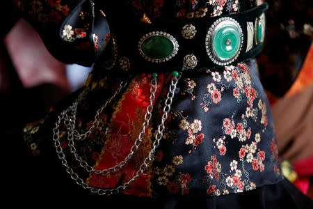 Details of medium Luong Nguyen's dress are seen as she performs during a ritual at a Hau Dong ceremony at Den Ngoc temple in Hanoi, Vietnam, February 12, 2017. REUTERS/Kham