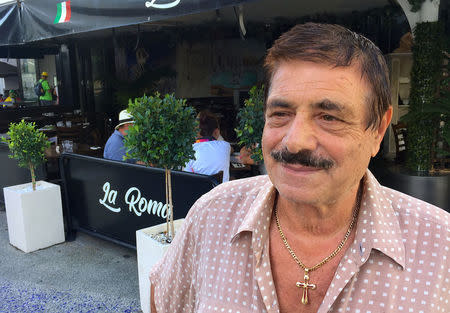 Restaurant owner Armando Cozzolino stand outside his restaurant called 'La Roma' located in Broadbeach on the Gold Coast in Australia, April 7, 2018. REUTERS/Ian Ransom