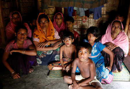 A group of Rohingya refugees takes shelter at the Kutuupalang makeshift refugee camp, after crossing the Myanmar-Bangladesh border today in Cox’s Bazar, Bangladesh, August 26, 2017. REUTERS/Mohammad Ponir Hossain