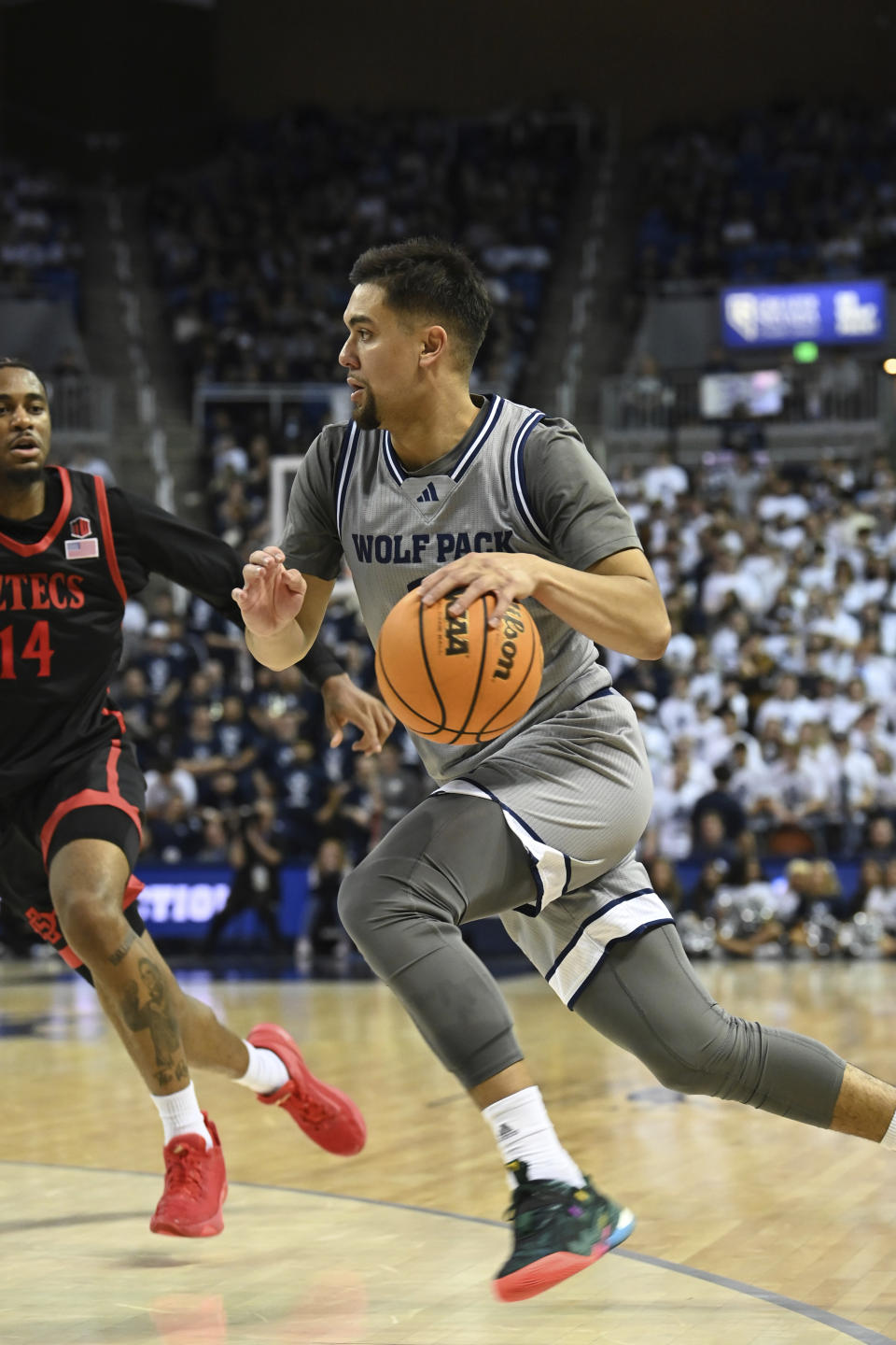 Nevada's Jarod Lucas drives against San Diego State during the second half of an NCAA college basketball game Friday, Feb. 9, 2024, in Reno, Nev. (AP Photo/Andy Barron)