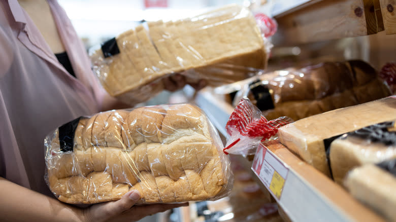 Two loaves of sliced bread in bags