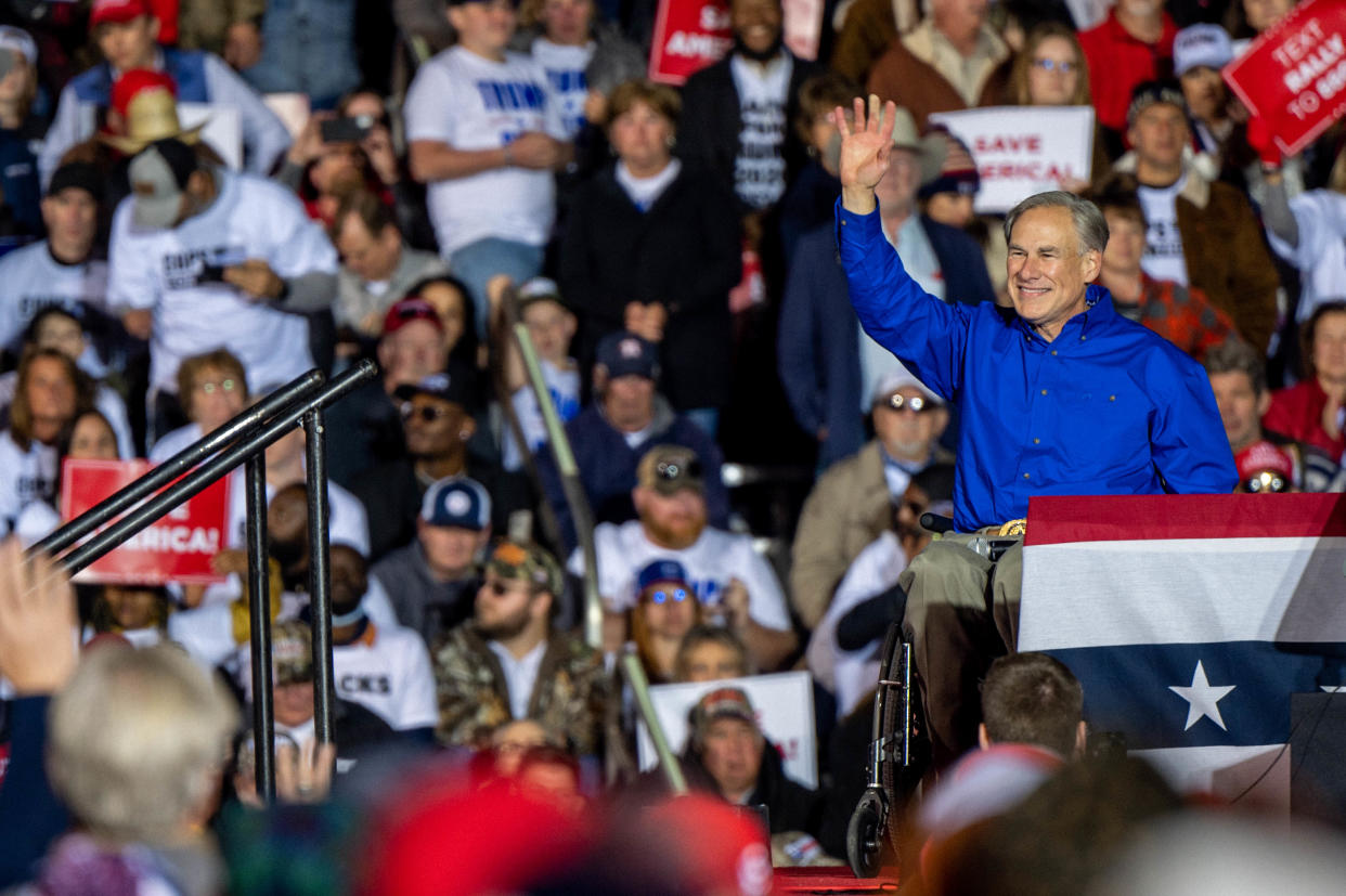 Texas Gov. Greg Abbott waves to supporters at a campaign rally.