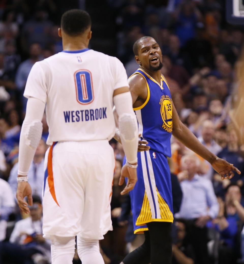 Golden State's Kevin Durant (35) and Oklahoma City's Russell Westbrook (0) have words during an NBA basketball game between the Oklahoma City Thunder and the Golden State Warriors at Chesapeake Energy Arena in Oklahoma City, Saturday, Feb. 11, 2017. Photo by Nate Billings, The Oklahoman