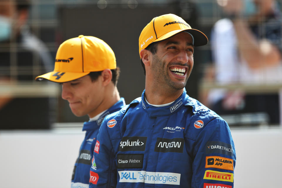 Daniel Ricciardo (pictured right) smiles from the grid during Day One of F1 Testing.