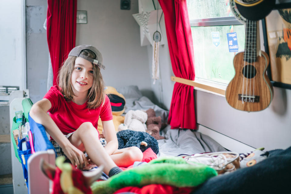 George on his bed in his room on the boat. (@narrowboatmama/Caters)