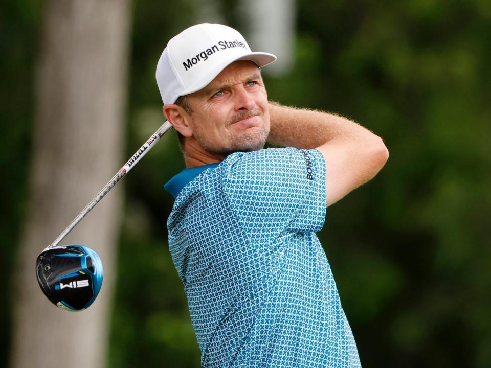 Justin Rose swings his golf club at Charles Schwab Challenge tournament.