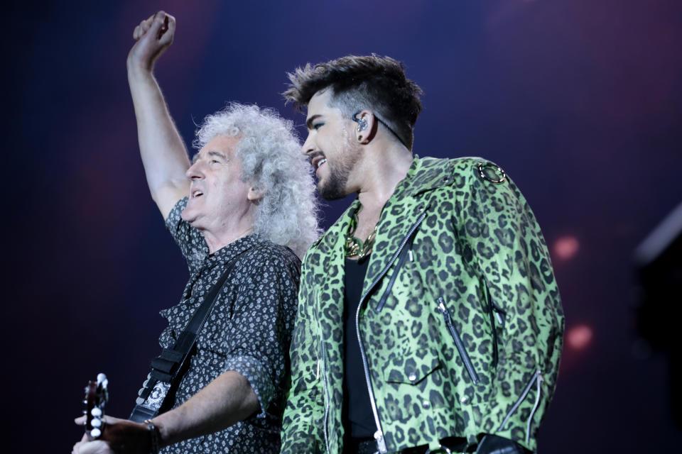 May (left) still performs with Queen + Adam LambertGetty Images