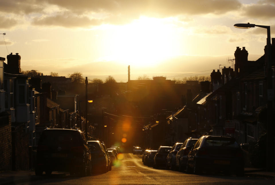 The sun sets on a street with terraced houses in Rotherham, northern England, February 4, 2015. Rotherham's council leader and entire cabinet resigned after the publication of a report into their response to  years of child sexual exploitation in the town. The report said the authority was not fit for purpose and had been in complete denial after an earlier inquiry found that 1400 children, some as young as 11, were abused in Rotherham, by gangs of predominantly Asian men. REUTERS/Darren Staples   (BRITAIN - Tags: CRIME LAW POLITICS SOCIETY)