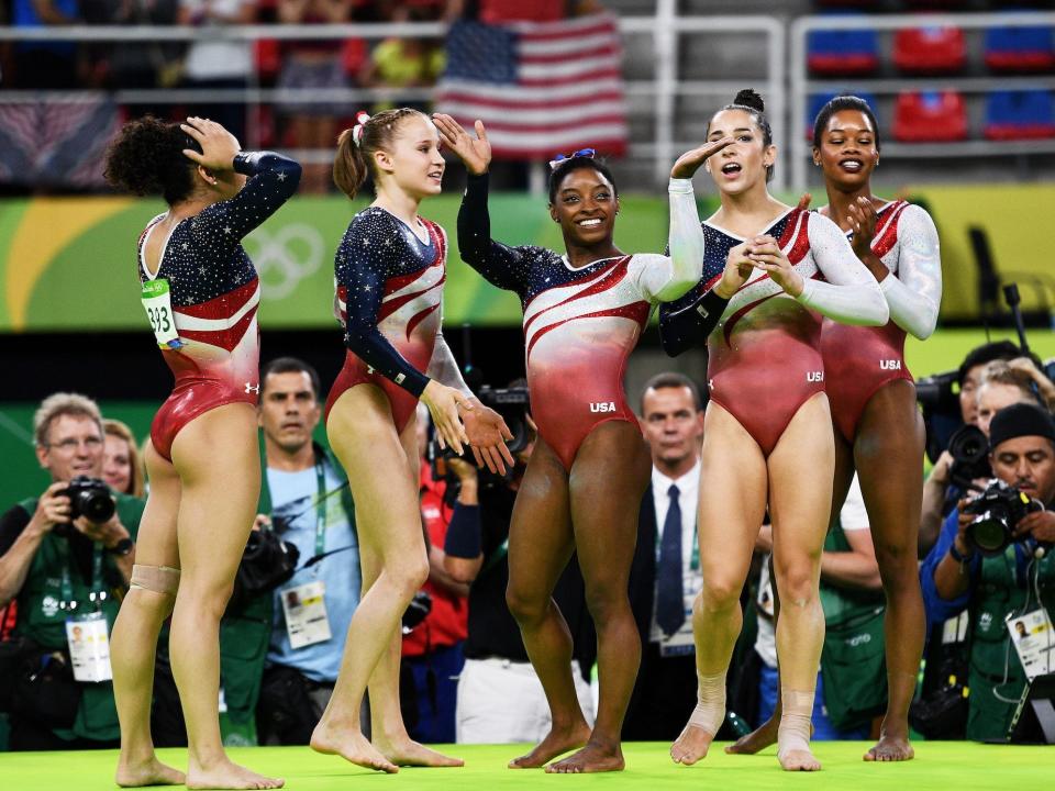 Team USA's gymnasts celebrate winning gold medals at the 2016 Olympics.