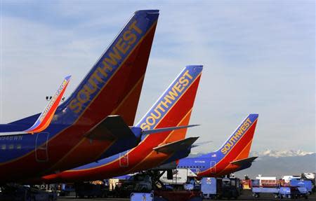 Southwest Airlines jets wait on the tarmac at Denver International Airport in Denver January 22, 2014. REUTERS/Rick Wilking