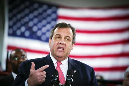 New Jersey Governor Chris Christie gestures as he speaks to media and homeowners about the ongoing recovery from Hurricane Sandy in Manahawkin, New Jersey January 16, 2014. REUTERS/Lucas Jackson