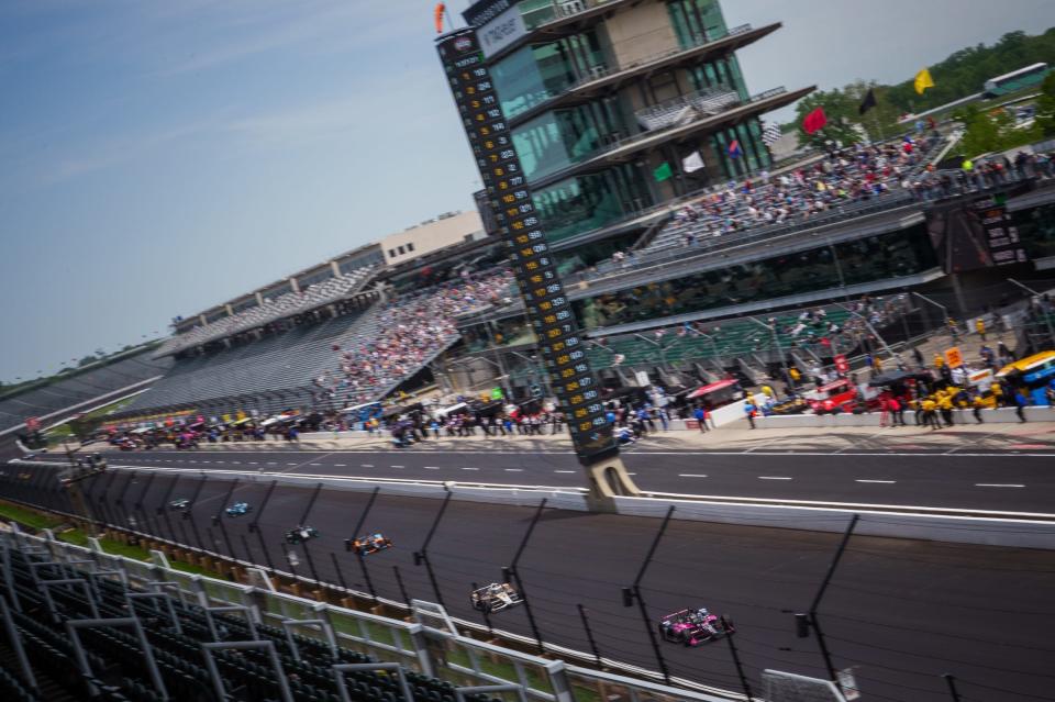 Fans watch as teams practice Monday, May 23, 2022, during practice in preparation for the 106th running of the Indianapolis 500 at Indianapolis Motor Speedway. 