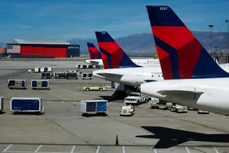 FILE PHOTO - Delta planes line up at their gates while on the tarmac of Salt Lake City International Airport in Utah September 28, 2013. REUTERS/Lucas Jackson/File Photo