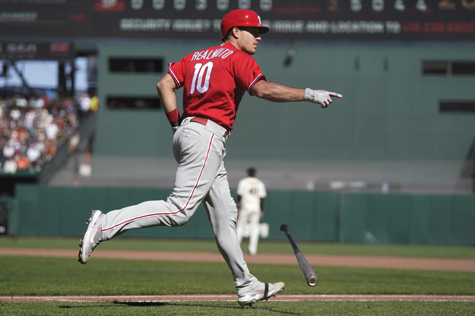 Philadelphia Phillies' J.T. Realmuto gestures toward teammates after hitting a three-run home run against the San Francisco Giants during the eighth inning of a baseball game in San Francisco, Sunday, Sept. 4, 2022. (AP Photo/Jeff Chiu)