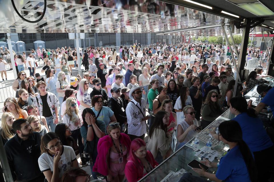 Fans arrive at State Farm Stadium for the opening night of Taylor Swift's "The Eras" Tour on March 17, 2023 in Glendale, Arizona.