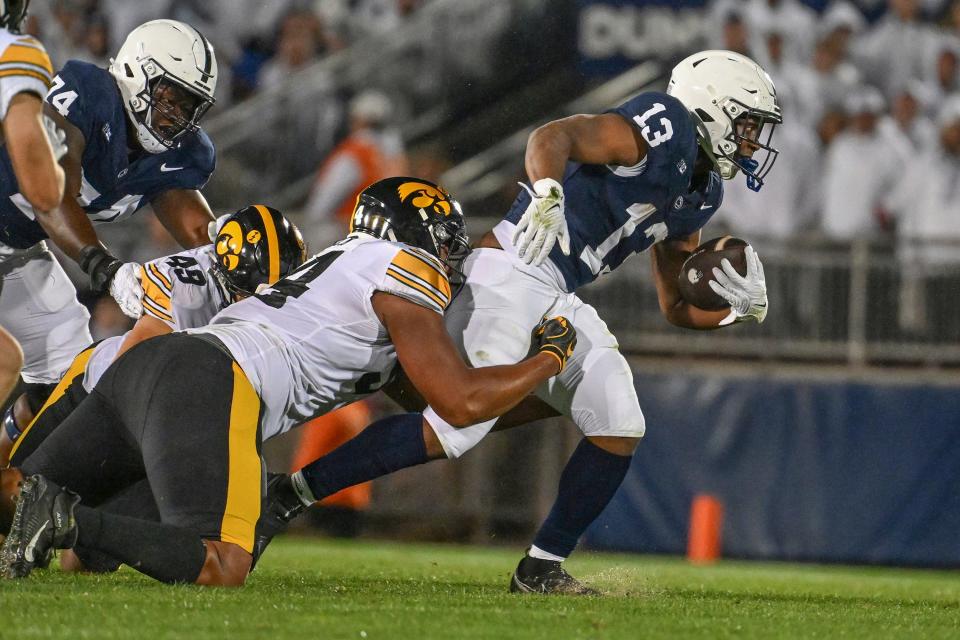 Penn State's Kaytron Allen (13) and teammate Nick Singleton look to have an easy path to their first, true breakout games of 2023. UMass offers about the worst run-defense in the NCAA.