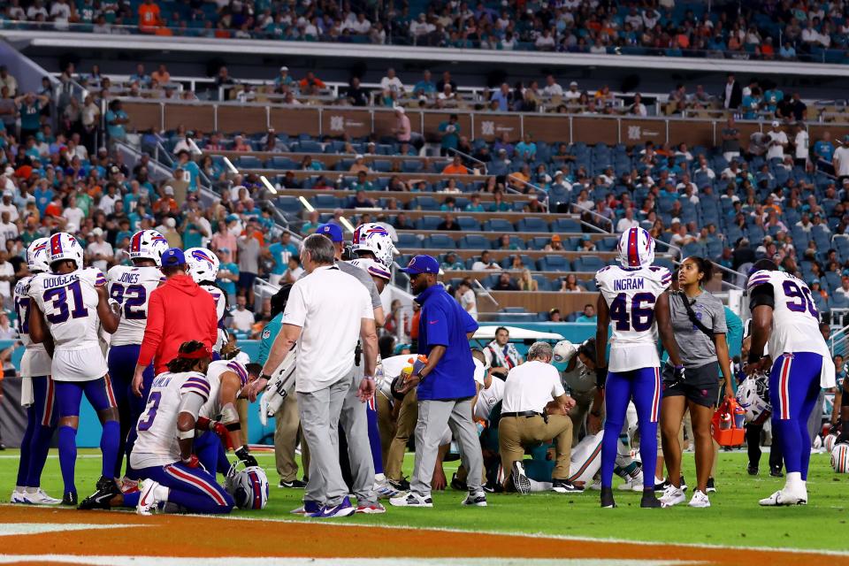 MIAMI GARDENS, FLORIDA - SEPTEMBER 12: Tua Tagovailoa #1 of the Miami Dolphins lays on the ground after colliding with Damar Hamlin #3 of the Buffalo Bills during the third quarter in the game at Hard Rock Stadium on September 12, 2024 in Miami Gardens, Florida. (Photo by Megan Briggs/Getty Images)