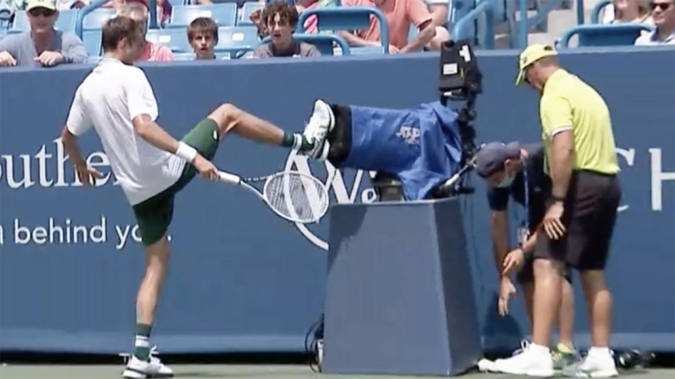 Russian world No.2 Daniil Medvedev kicked out at a broadcast camera placed on court after colliding with it during the second set of his match against Andrey Rublev at the Western and Southern Open. Picture: Twitter