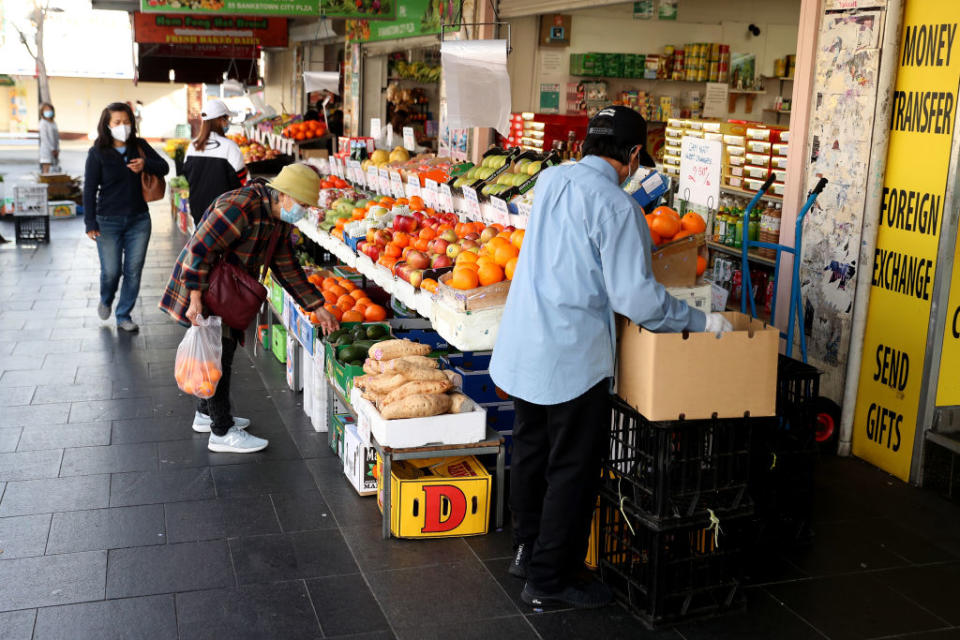 Customers shop for fresh produce at a store in the Bankstown surburb of Sydney, Australia.