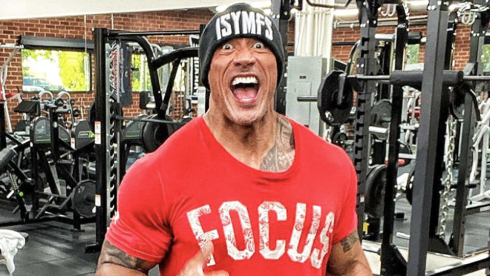 The Rock flexes after a gym session.