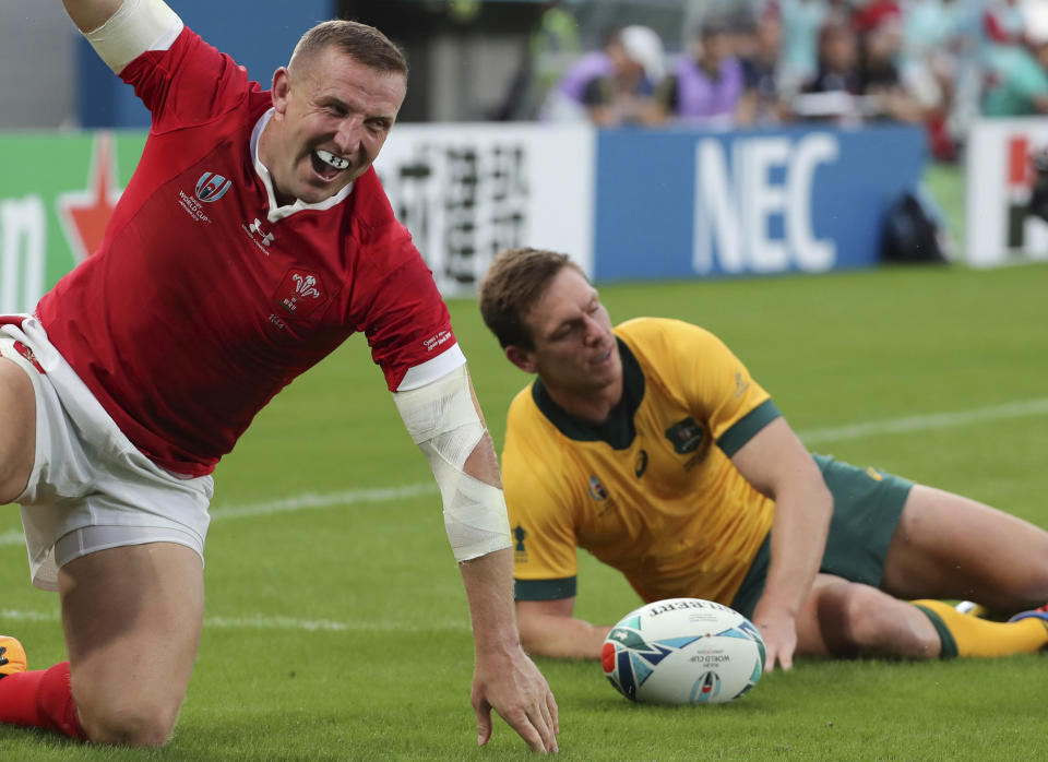 Wales Hadleigh Parkes celebrates after scoring a try during the Rugby World Cup Pool D game at Tokyo Stadium between Australia and Wales in Tokyo, Japan, Sunday, Sept. 29, 2019. (AP Photo/Koji Sasahara)