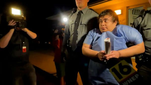 PHOTO: Adrian Oswaldo Sura Reyes, who is a suspect in both a fatal crash and a homicide, is escorted by State Police troopers from their Shickshinny station after his arrest in Berwick, Pa., Aug. 14, 2022. (WNEP via Reuters)