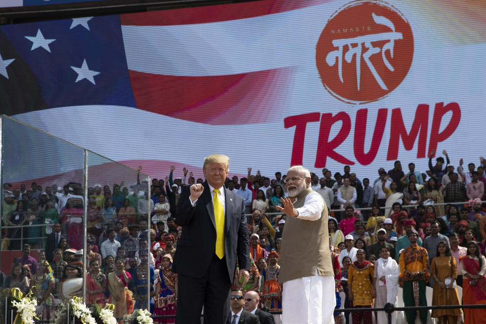 U.S. President Donald Trump and Indian Prime Minister Narendra Modi wave after a "Namaste Trump," event at Sardar Patel Gujarat Stadium, Monday, Feb. 24, 2020, in Ahmedabad, India. India poured on the pageantry with a joyful, colorful welcome for President Donald Trump on Monday that kicked off a whirlwind 36-hour visit meant to reaffirm U.S.-India ties while providing enviable overseas imagery for a president in a re-election year. (AP Photo/Alex Brandon)