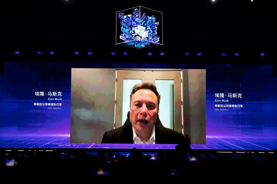  Tesla CEO Elon Musk speaks via video during the opening ceremony of 2023 World Artificial Intelligence Conference at Shanghai World Expo Exhibition and Convention Center on July 6, 2023 in Shanghai, China.