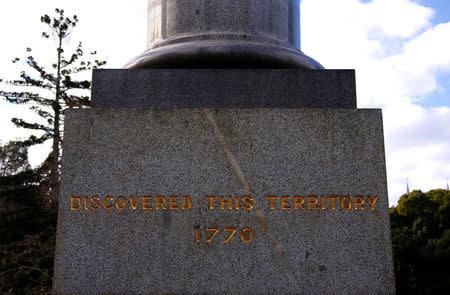 A statue of British explorer Captain James Cook, which includes the inscription 'Discovered this Territory 1770', stands in Hyde Park located in central Sydney, Australia, August 24, 2017. REUTERS/David Gray