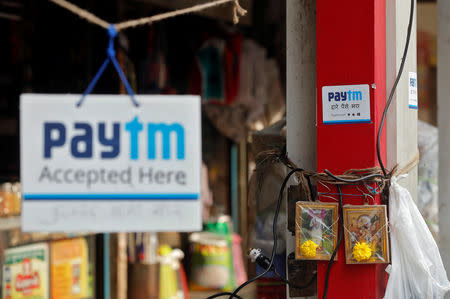 Advertisements of Paytm, a digital wallet company, are seen placed at stalls of roadside vegetable vendors in Mumbai, November 19, 2016. REUTERS/Shailesh Andrade/Files