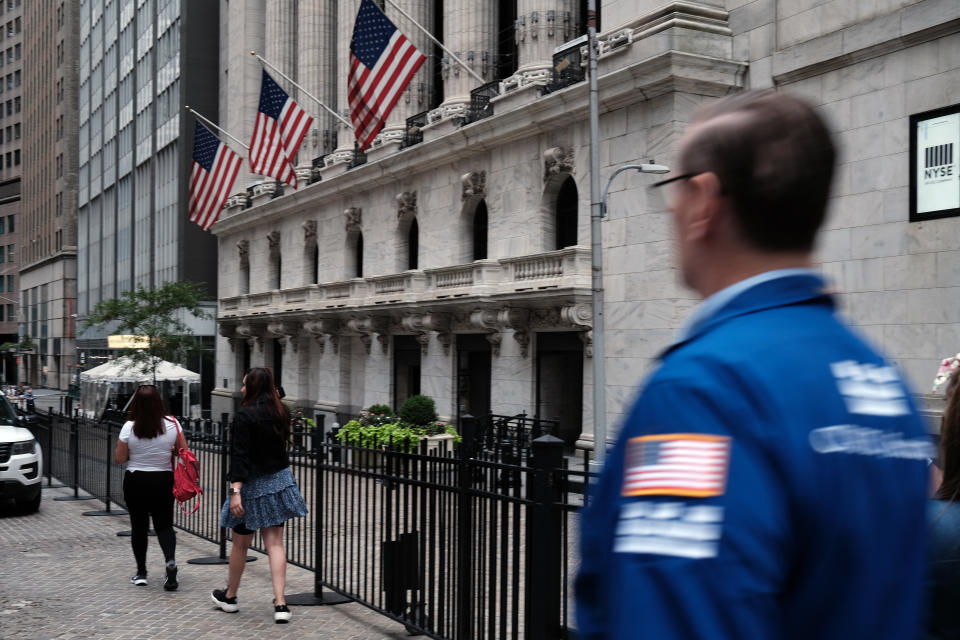 NEW YORK, NEW YORK - SEPTEMBER 16: People walk by the New York Stock Exchange (NYSE) on September 16, 2021 in New York City. Despite a rise in retail sales, the Dow slipped lower on Thursday as investors continue to have concerns from the Delta variant and news of a light rise in jobless claims.  (Photo by Spencer Platt/Getty Images)