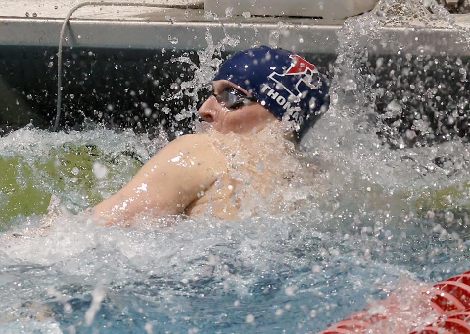 Pennsylvania's Lia Thomas touches the wall to win the 100-yard freestyle final at the Ivy League women's swimming and diving championships at Harvard University, Saturday, Feb. 19, 2022, in Cambridge, Mass. Thomas, who is transitioning to female, is swimming for the Penn women's team. (AP Photo/Mary Schwalm)