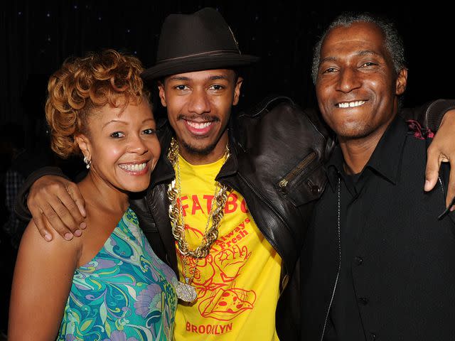 <p>Kevin Winter/Getty</p> Nick Cannon with his mother Beth and father James at his 30th birthday bash at Universal Studios Hollywood on October 9, 2010.