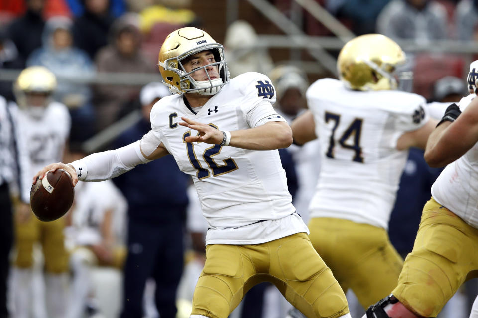 Notre Dame Fighting Irish quarterback Ian Book (12) throws a pass during the second quarter against the Stanford Cardinal. (USA Today Sports)