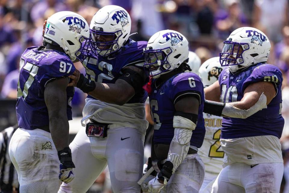 TCU defensive lineman Paul Oyewale (97) celebrates with his teammates after getting a sack during a college football game between the TCU Horned Frogs and the Colorado Buffaloes at Amon G. Carter Stadium in Fort Worth on Saturday, Sept. 2, 2023.