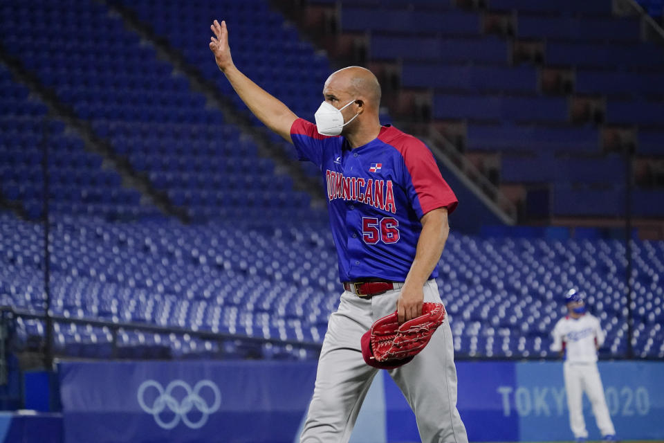 Dominican Republic's Raul Valdes (56) leaves the team's baseball game against South Korea during the sixth inning of a baseball game at the 2020 Summer Olympics, Sunday, Aug. 1, 2021, in Yokohama, Japan. (AP Photo/Sue Ogrocki)