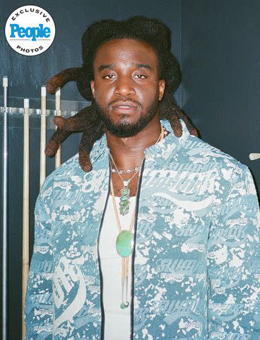 <p>Brenton Blanchet</p> Shaboozey poses in New York City's Rockefeller Center on May 30, 2024