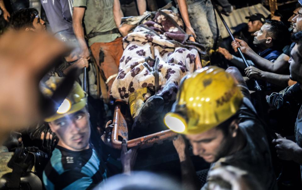 An injured miner came out carried by rescuers after an explosion in Manisa on May 13, 2014.(BULENT KILIC/AFP/Getty Images)