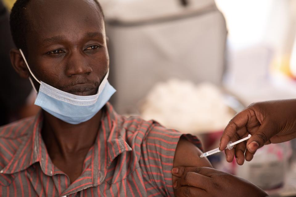 A healthcare professional is vaccinated against COVID-19 on March 10, 2021 in Kampala, Uganda (Getty Images)