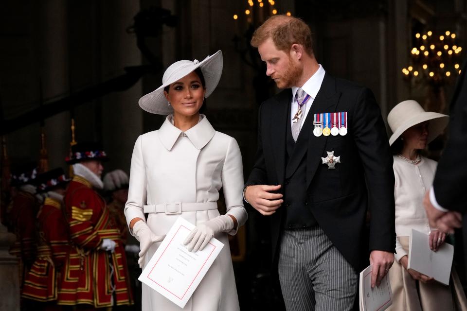 prince harry and meghan markle attending a service celebrating queen elizabeth's platinum jubilee