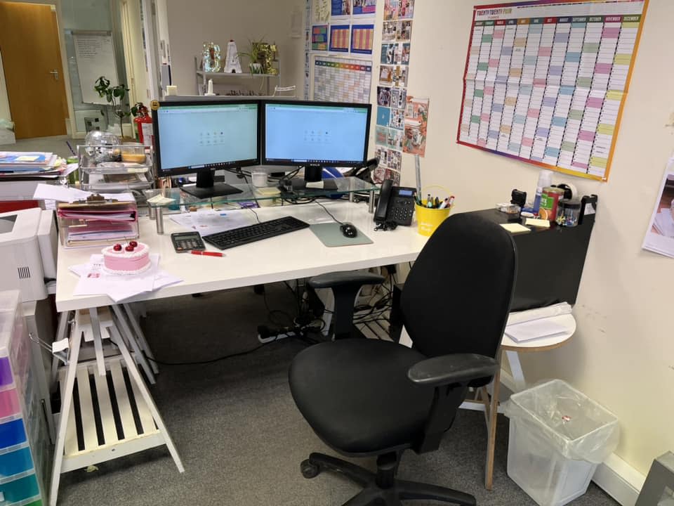 Desk with monitors on it 