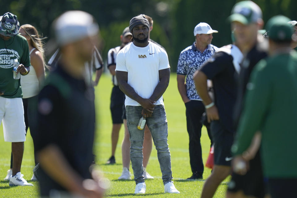 Running back Dalvin Cook watches a New York Jets practice session at the NFL football team's training facility in Florham Park, N.J., Sunday, July 30, 2023. (AP Photo/Seth Wenig)