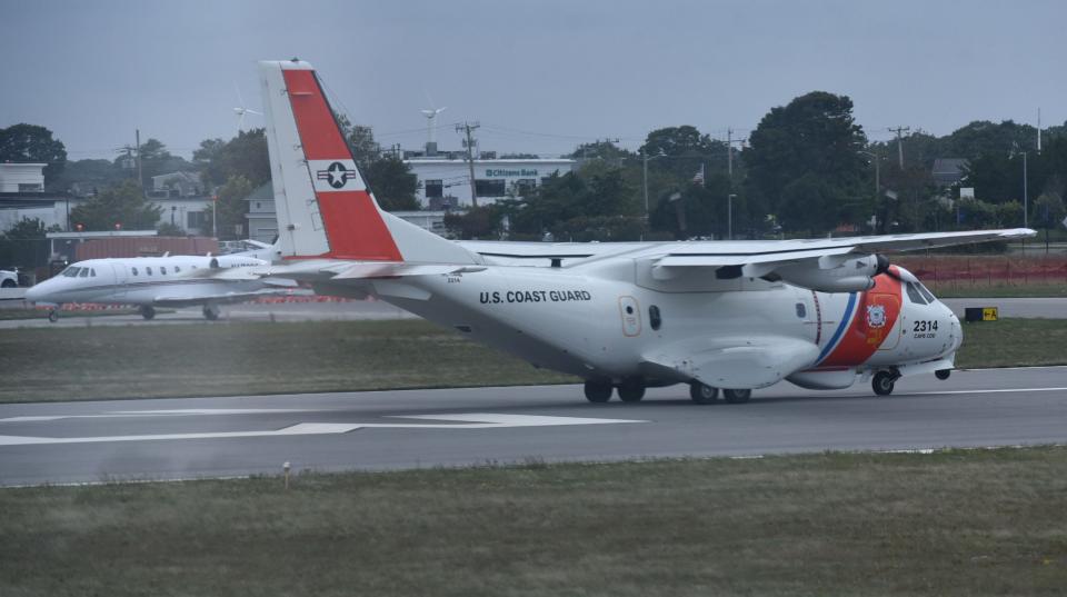 A Coast Guard plane shares the taxiway with a private jet in September as they prepare to take off at the Cape Cod Gateway Airport in Hyannis. The Coast Guard from Air Station Cape Cod is staging some of their aircraft in Hyannis since runway work is underway at Joint Base Cape Cod.