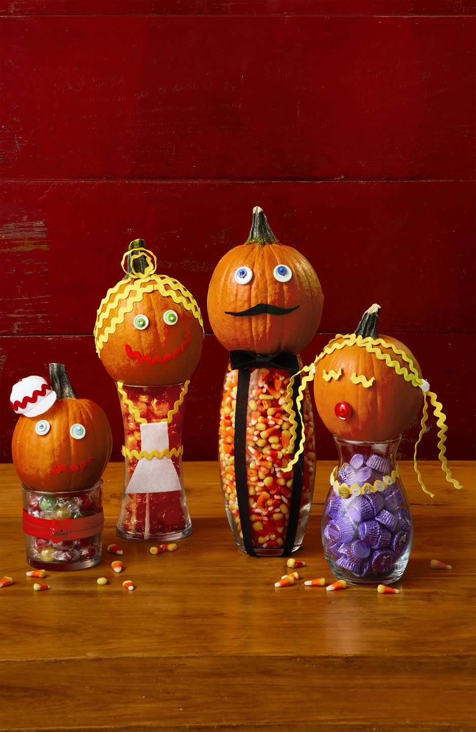 <p>Fill clear jars with candy. Decorate small to medium pumpkins with rickrack, googly eyes, buttons, felt, and zippers to create features and wardrobe. Use pins and hot glue to attach. For baseball cap, cut a 1½-inch Styrofoam ball in half. Cut four to five white felt triangles to form dome and a semicircle for brim. Attach with glue and add rickrack for embellishment.</p><p><a class="link " href="https://www.amazon.com/50Yards-Colorful-Bending-Wrapping-Decoration/dp/B091FBJ4XX?tag=syn-yahoo-20&ascsubtag=%5Bartid%7C10070.g.331%5Bsrc%7Cyahoo-us" rel="nofollow noopener" target="_blank" data-ylk="slk:SHOP RICKRACK;elm:context_link;itc:0;sec:content-canvas">SHOP RICKRACK</a></p>