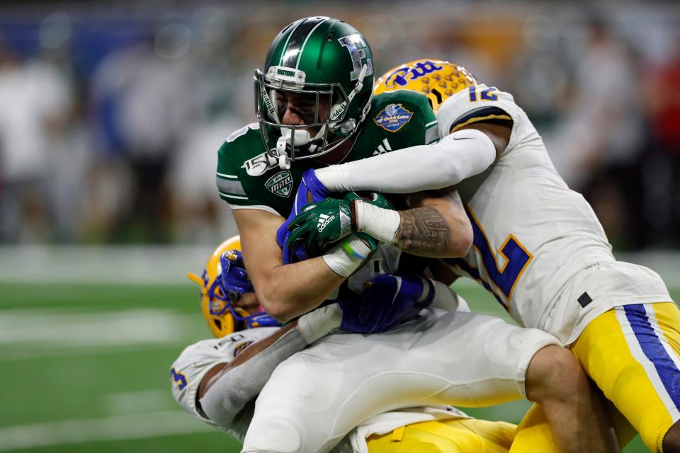 Eastern Michigan receiver Hassan Beydoun is tackled vs. Pittsburgh in the Quick Lane Bowl, Dec. 26, 2019, in Detroit.