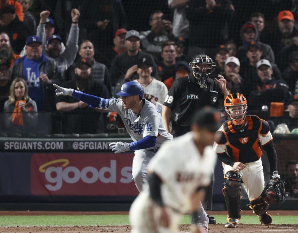 October 14: Los Angeles Dodgers' Cody Bellinger gestures after hitting the go-ahead RBI single