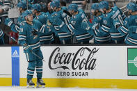 San Jose Sharks right wing Timo Meier (28) is congratulated by teammates after he scored against the Anaheim Ducks during the second period of an NHL hockey game in San Jose, Calif., Tuesday, Nov. 1, 2022. (AP Photo/Jeff Chiu)